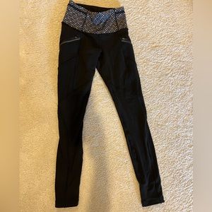Lululemon black leggings with patterned waistband and pockets
